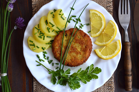 Homemade fish-burger on the plate