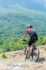 Fototapeta premium Mountain biker riding cross country