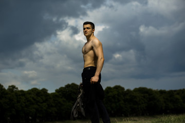 Sexy muscular man with bag