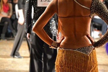 Pair doing latin ballroom dance during tournament