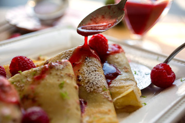 Crepes with raspberry cassis sauce