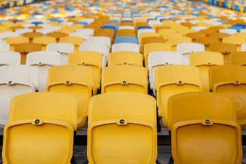 Rows of empty plastic stadium seats