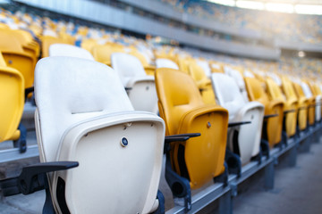 Rows of empty plastic stadium seats