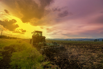 Fototapeta premium Tractor plowing