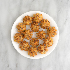 Chocolate chip macaroons in a dish on marble table top view