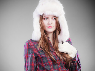 Young woman in winter clothing fur cap