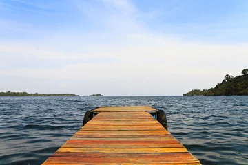 Tuinposter Wooden dock on a lake © Coy St. Clair
