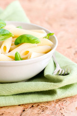 Macaroni and basil leafs