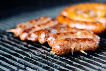 Grilled sausages on the grill