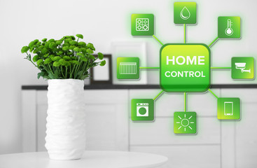 Smart home control concept. Room interior, vase with flowers on table