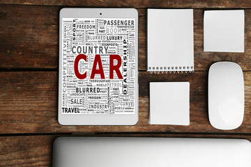 Set of office stationery with a computer on a wooden background. Car word collage