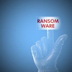 Hacker wearing black glove clicking on ransomware button on a mo
