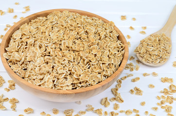 Oatmeal in bamboo bowl and spoon