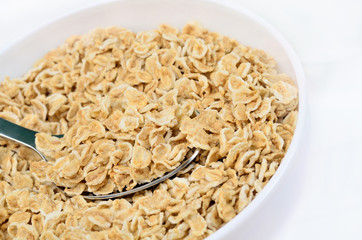 Oat flakes in ceramic white bowl