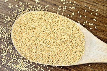 Amaranth seeds in wooden spoon