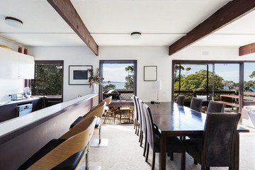 View of the ocean from retro beach house dining room