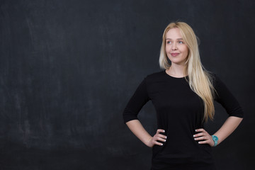 Portrait of attractive female teenager with long blond hair, bla