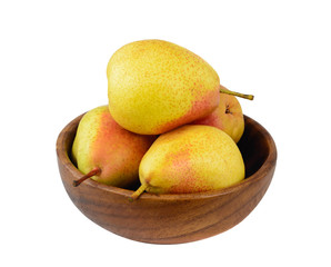 Ripe pears in a wooden bowl isolated on white.