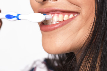 Woman brushing her teeth.