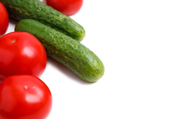 Fresh vegetables isolated on a white background. tomato and cucumber. close up. horizontal