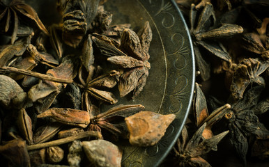 Spices. Anise stars photo. Intentionally blurred lens focus effect. Color toning.