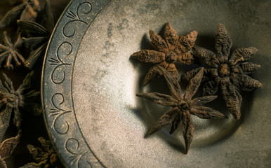 Spices. Anise stars photo. Intentionally blurred lens focus effect.