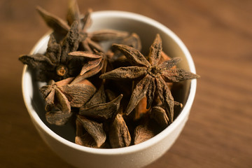 Spices. Anise stars photo. Intentionally blurred lens focus effect.