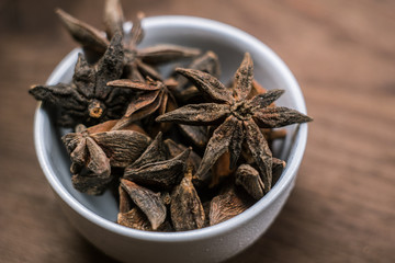 Spices. Anise stars photo. Intentionally blurred lens focus effect.