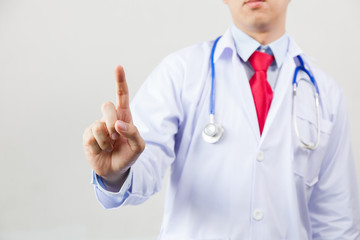 Medical doctor using one finger for pressing virtual touch screen on white isolated background