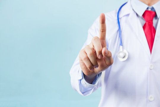 Medical Doctor Using One Finger For Pressing Virtual Touch Screen On Blue Isolated Background