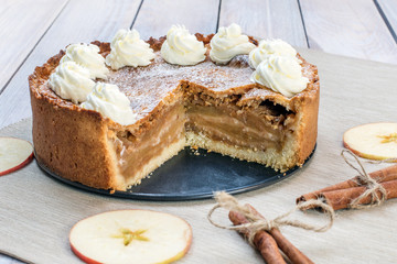 Sliced Apple Pie with Whipped Cream with Cinnamon and Apple Slic