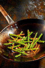 Healthy fresh cooked asparagus tips and carrots