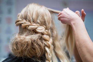 Application of wedding makeup. Preparation of the bride. Boho style. Ease of braided hair braids.