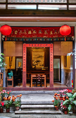 Traditional oriental chinese heritage building door with spring couplets & red lantern in Taiwan (Chinese Translation on board : clan of yao)