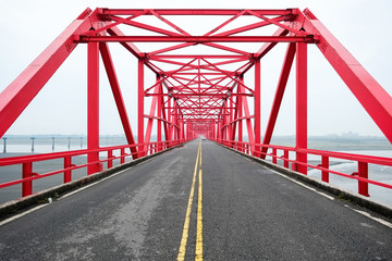 Symmetrical red steel structure construction of bridge and road in Xiluo, Taiwan