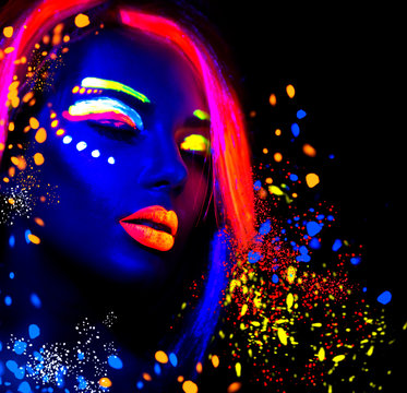 Fashion model woman in neon light, portrait of beautiful model girl with fluorescent make-up