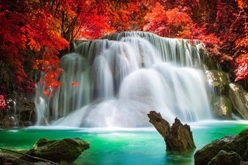 Fototapeta na wymiar Waterfall in beautiful autumn forest 