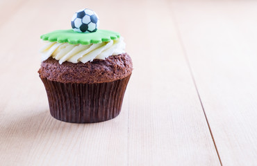 Delicious cupcake on table