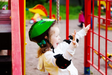 Fototapeta na wymiar Girl playing on the Playground