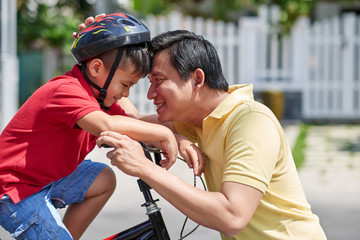 Vietnamese father and son spending weekend together