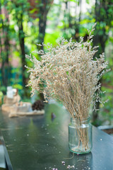 Dried flowers on wood table