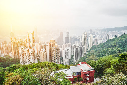 Business concept for real estate and corporate construction - panoramic modern city skyline bird eye aerial view with dramatic sunrise and morning blue sky in Hong Kong (HK), China