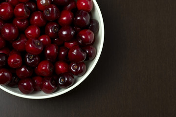 Cherries isolated on dark background