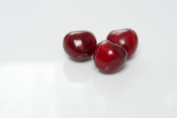 Three peaches isolated on white background