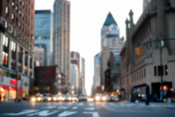 Obraz premium Defocused image of midtown 8th Avenue facing downtown, with car headlights blurred