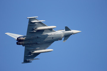 Naklejka na ściany i meble Fighter jet in the sky