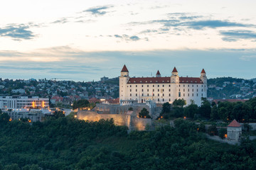 Naklejka na ściany i meble Bratislava, Slovakia - Castle and parliament, sunset view from observation deck of the Bridge