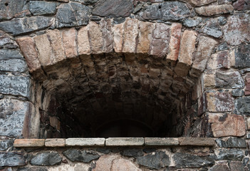 Fototapeta premium Stone wall medieval texture with loophole background