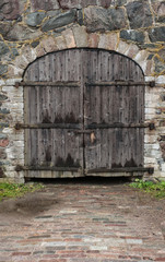 Old medieval door and stone wall texture