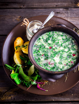 Traditional Russian cold soup with vegetables - okroshka .